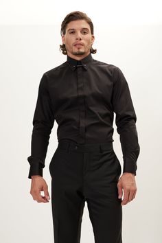 Our hidden placket shirt is tailored from pure cotton-sateen, so it's crisp and breathable. It has an immaculately tailored cutaway collar that accommodates wider ties and fastens with a silver tone tie-bar. The deep black works well with dark suiting. Made with European pure cotton premium 50s single-ply sateen fabric. It is silky and refined. This high thread count makes a shirt that looks great with denim casually, or a clean suited look. Fitted construction 100% Cotton Sateen Made in Turkey Black Shirt Styling, Bar Shirt, James Maslow, Collar Pin, Derek Hough, Cutaway Collar, Dark Denim Jeans, Tie Bar, Making Shirts