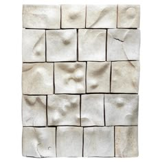 a white tile wall that has been made out of small squares