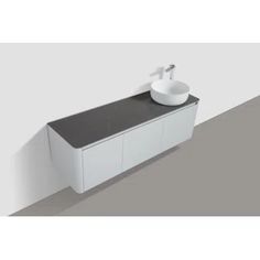 a white sink sitting on top of a black counter