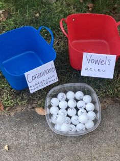 three plastic bowls with white balls in them sitting on the ground next to each other