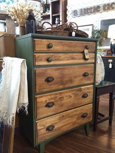 an old dresser is being displayed in a store