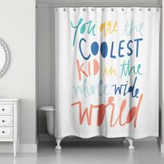 a bathroom with a shower curtain that says you are the coolest kid in the world