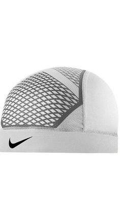 a white hat with black and grey designs on it