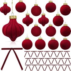 a bunch of red christmas ornaments hanging from strings