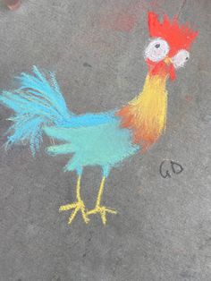 a drawing of a rooster on the sidewalk