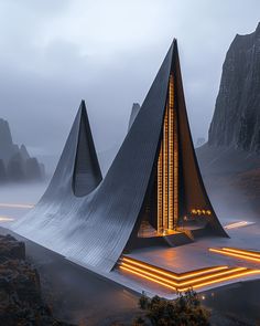 an unusual building is lit up in the fog with mountains in the background at night