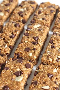 chocolate chip granola bars lined up on a baking sheet