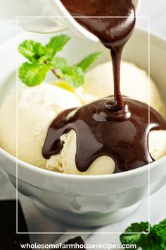 ice cream with chocolate sauce being drizzled over it in a white bowl