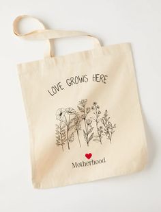 MOTHERWOOD LOVE GROWS HERE TOTE BAG Brand New 241-B16 14.5x16x1 Love Grows Here, Holiday Tote Bag, Mothers Bag, Christmas Tote Bags, Christmas Tote, Bundle Of Joy, Cream Style, Canvas Shopping Bag, Letter Art