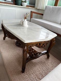 a marble top coffee table in a living room