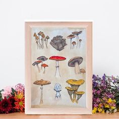 a painting of mushrooms on a table next to flowers