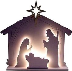 an illuminated nativity scene with the birth of jesus and baby jesus in manger