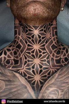 a man with tattoos on his neck and chest