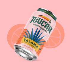 a can of tequila on a pink background with an orange slice in the bottom right corner