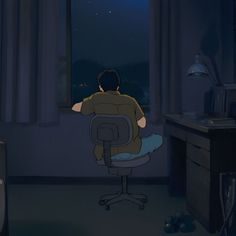 a man is sitting in an office chair looking out the window at the night sky