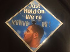 a graduation cap with the words just hold on we're moving on