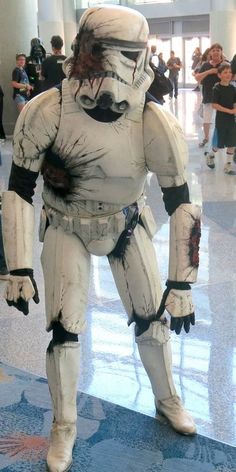 a costumed man dressed as stormtrooper in an airport