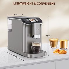 the coffee maker is sitting on top of the counter with measurements for it's contents