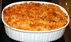 a casserole dish is sitting on the stove top, ready to be eaten