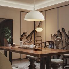 a dining room table with chairs and a large painting on the wall in the background