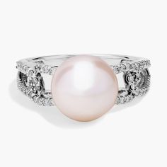 a white pearl and diamond ring