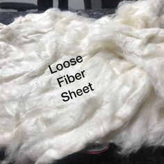 close up of white wool with the words loose and loose