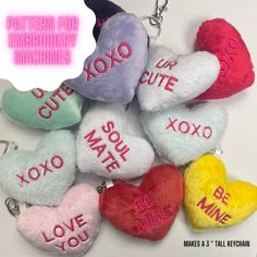 several heart shaped key chains with words written on them