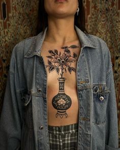 a woman with a tattoo on her chest