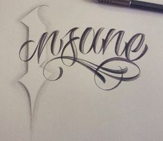 the word insure written in cursive writing on a piece of paper with a pen next to it