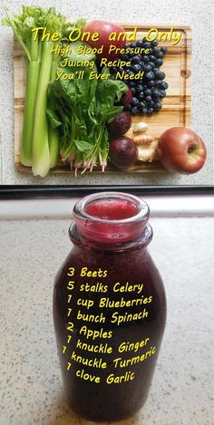 a jar filled with fruit and vegetables next to a cutting board