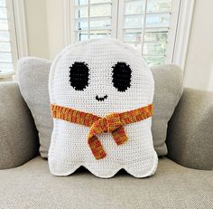 a crocheted pillow that looks like a ghost