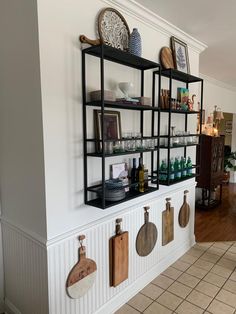 the kitchen is clean and ready to be used as a place for cookbooks, wine glasses, etc