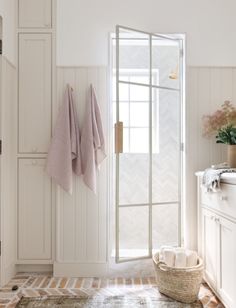 a bathroom with towels hanging on the wall