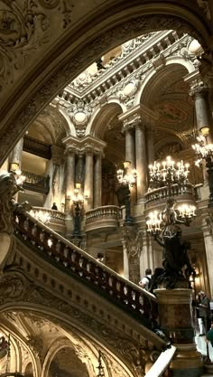 an ornate building with many chandeliers and lights