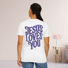 a woman wearing a t - shirt that says jesus loves you