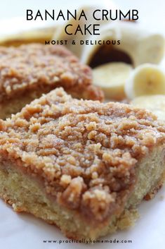 two pieces of banana crumb cake sitting on top of a white plate next to sliced bananas