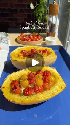 two bowls filled with food sitting on top of a blue table