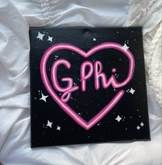 a black and pink heart with the word g p r painted on it