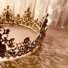 a gold tiara sitting on top of a table