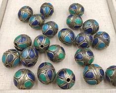 The Price is Set For 1 Pices Please how many pieces do you want ! It's Handmade Silver Plated Beads From Afghanistan with Lapis And Turquoise Stone Inlaid its Vintage 70 to 80 years Before Made in AfghanistanMaterial Brass Silver Plated Gemstone Turquoise and LapisSize 26mm Bohemian Blue Jewelry With 8mm Beads, Traditional Turquoise Jewelry With 8mm Beads, Turquoise Round Beads Bracelet For Crafting, Green Beads For Jewelry Making And Festivals, Blue Beads For Jewelry Making And Festivals, Artisan Blue Beads For Jewelry Making, Bohemian Beads For Jewelry Making, Blue Metal Beads Jewelry As Gift, Turquoise Jewelry With 8mm Beads For Festival