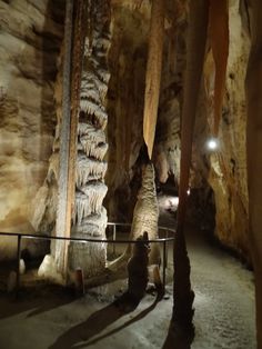 the inside of a cave filled with lots of rock formations