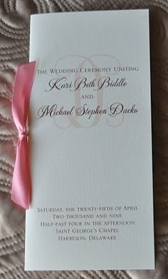 wedding program booklet with pink ribbon and monogrammed font on white card stocking