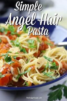 a blue bowl filled with pasta covered in sauce and garnished with parsley