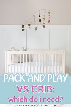 a baby crib with stars hanging from it and the words pack and play vs crib which do i need?