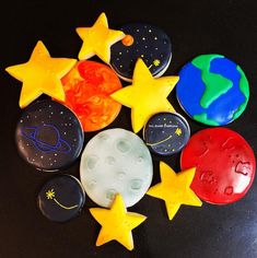 there are many stars and moon cookies on the table