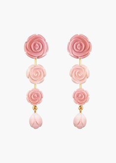 The dreamiest of drops, the Tyla Earrings call to mind scenes of bucolic English rose gardens. The linear garland of roses has a lengthening effect, tapering towards a delicate rosebud detail, which sways gently at the bottom. Made by hand in New York of natural shell, the organic color variations create dimension like one would find in real flowers. Italian Minimalism, Pave Ear Cuff, Rose Earring, 2023 Ideas, Novelty Jewelry, Rose Gardens, Jewelry Styling, Wishlist 2024, Pirate Treasure