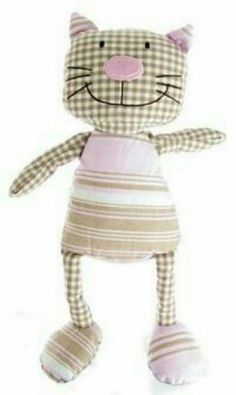 a stuffed cat is wearing a dress and standing up with it's legs spread out