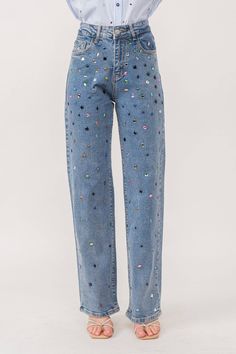 Rhinestone denim pants Stretch denim Straight leg fit Multicolor hotfix rhinestone embellishment. Front zip and button closure Classic 5-pocket construction Styled with Model is 5 ft 6 in, wearing a Small. Bust: 32 in Waist: 24 in Hips: 35 Late 20s Womens Fashion, Sequin Jeans Outfit, Concert Outfit Comfortable, Rhinestone Denim Jeans, Moda Operandi Pants, Denim With Lace, Rhinestone Jeans Diy, Classic Denim Jeans, Warm Eras Tour Outfits