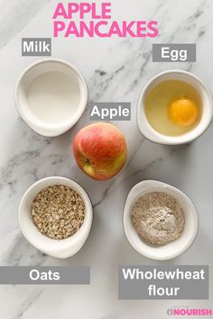 ingredients to make apple oatmeal in bowls on a marble counter top, labeled with the names