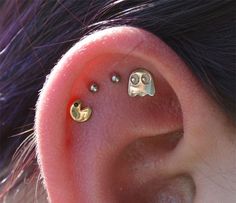 an ear with two little smiley faces on it